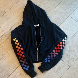 soulcycle Black Cropped Zip Hoodie with Rainbow Checkerboard Sleeves. Super cute